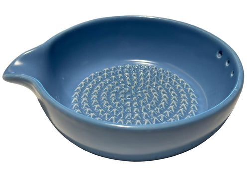 Blue ceramic bowl with grater, spout and herb stripper